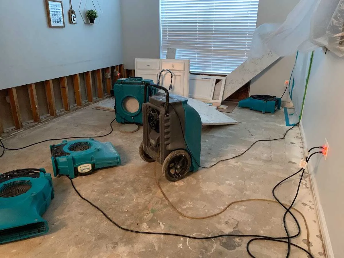 Dehumidifier in flood-cut room for Water Damage Restoration in Centennial